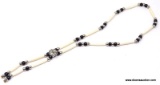 NATIVE AMERICAN BONE HAIR PIPE AND JET BEADED NECKLACE. CENTER FOCAL POINT FEATURES ROUND NATIVE