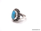 EARLY UNSIGNED DESIGNER, MONROE JACKSON STERLING SILVER AND BISBEE TURQUOISE RING. SPLIT SHANK