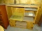 WOODEN ENTERTAINMENT CENTER WITH TV CUT-OUT, 3 SIDE SHELVES, 2 LOWER CABINET DOORS AND CENTER SHELF.