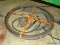 LOT INCLUDES : A #100D FLAT STEEL SEWER ROD, AND A COIL OF METAL WIRE CABLE.