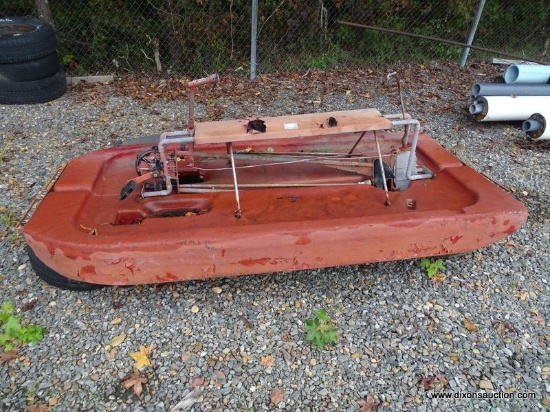VINTAGE PEDAL BOAT. NEEDS WORK. APPROX 7' LONG.