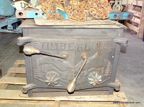 TIMBERLINE 2 DOOR CAST IRON WOOD FIRE STOVE. MEASURES APPROX. 28.25" X 26.5" X 23" TALL.