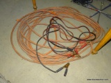 HEAVY DUTY ORANGE EXTENSION CORD WITH 3-WAY PLUG, AND A SET OF BATTERY CABLES.