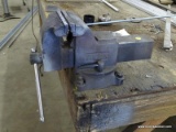 WILTON TABLE TOP WORK VISE. CURRENTLY ATTACHED TO A WOODEN TABLE, PLEASE BRING TOOLS TO REMOVE.