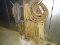 LARGE LOT OF HOSES AND PLASTIC TUBING HANGING ON STAND.