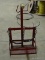 SMALL RED METAL GAS WELDING BOTTLE HOLDER.