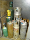 LOT OF (9) ASSORTED GAS BOTTLES. COMPRESSED OXYGEN AND ACETYLENE.