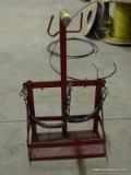 SMALL RED METAL GAS WELDING BOTTLE HOLDER.