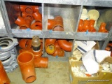 (6) CUBBY LOT OF CAST IRON PLUGS, VICTAULIC RINGS/CLAMPS AND CAST IRON TEES.