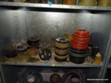 SHELF LOT TO INCLUDE OVER (30) ASSORTED SIZED CAST IRON FLANGES, AND OTHER ASSORTED PIPE PIECES.