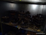 SHELF LOT TO INCLUDE OVER (30) ASSORTED SIZED CAST IRON FLANGES, AND OTHER ASSORTED PIPE FITTINGS..