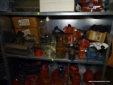 SHELF LOT OF CAST IRON PIPE SADDLES AND COUPLINGS.