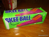 (FM) SKEEBALL TOY; IS IN THE ORGINAL BOX AND IS HOT PINK IN COLOR.