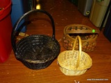 (FM) BASKET LOT; INCLUDES A BLACK WICKER BASKET, A SMALL WICKER BASKET, AND A MULTICOLOR WOVEN