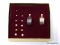 PREMIER DESIGNS, PAIR OF SILVER, GOLD TRIMMED EARRINGS WITH INTERCHANGEABLE STUDS. COMES WITH BOX.