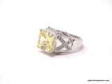 .925 STERLING SILVER RING WITH SQUARE CUT CITRINE GEMSTONE & SMALL CZ CHIPS ALONG THE BAND. COMES