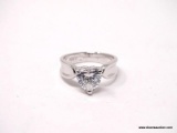 .925 STERLING SILVER RING WITH LARGE CENTER HEART SHAPED CZ STONE. COMES WITH BOX. RING SIZE IS
