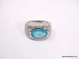 TECHNIBOND PLATINUM OVER .925 STERLING SILVER RING WITH LARGE SYNTHETIC OVAL AQUAMARINE ACCOMPANIED