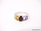 .925 STERLING SILVER MULTI-COLORED STONE RING. SIZE IS BETWEEN 5-1/4.
