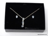 .925 STERLING SILVER & LIGHT BLUE TOPAZ PENDANT ON STERLING SILVER CHAIN. INCLUDES MATCHING PIERCED