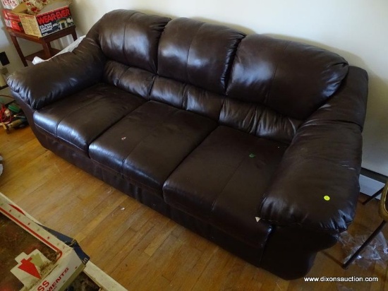 (LR) LEATHER SOFA; 3 CUSHION LEATHER SOFA IN DARK BROWN. IS IN VERY GOOD CONDITION AND MEASURES 84
