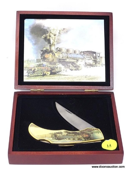 COLLECTORS FOLDING KNIFE WITH A TRAIN ON HANDLE. NUMBERED "11654". COMES IN PRESENTATION BOX.