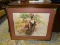 FRAMED PRINT OF AN ART DECO WOMAN; SHOWS A 1920'S WOMAN SITTING IN A RED CHAIR WITH A BLACK DRESS