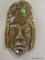 POLISHED STONE MASK; CARVED AND POLISHED STONE MASK WITH ROPE FOR HANGING ON THE WALL. IS IN