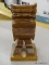 CARVED TIKI HEAD; SOLID WOODEN CARVED TIKI ON SQUARE BASE. IS IN EXCELLENT CONDITION AND MEASURES 5