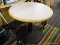 ICE CREAM TABLE; ROUND TOP TABLE WITH A CAST IRON BASE. IS IN GOOD CONDITION AND MEASURES 36 IN X 30