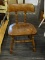 SIDE CHAIR; MAHOGANY AND LEATHER SIDE CHAIR WITH STUDDING AROUND THE EDGES OF THE BACK. HAS A PLANK