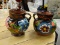 PAIR OF MEXICAN MADE POTTERY SINGLE HANDLED CONTAINERS; BOTH ARE HAND PAINTED WITH FLOWERS. BOTH ARE