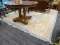 LARGE AREA RUG; IS IN HUES OF BLUE, YELLOW, PINK, AND CREAM. MEASURES 8 FT 10 IN X 11 FT 6 IN