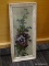 FRAMED FLORAL PRINT; IS IN A DISTRESSED WHITE FINISH FRAME WITH PURPLE AND BLUE FLOWERS. IS IN GOOD