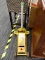 CAR JACK; YELLOW AND WHITE HYDRAULIC JACK. PLEASE PREVIEW FOR EXTRA DETAILS. MEASURES 14 IN X 24 IN