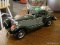 WOODEN MODEL CAR; GREEN AND GRAY WOODEN MODEL CAR IN GOOD USED CONDITION (FRONT BUMPER NEEDS TO BE