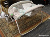 BABY CRADLE; ROCKING BABY CRADLE IN GRAY AND BLUE. IS IN GOOD CONDITION