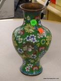 CLOISONNE VASE; GREEN, YELLOW, BLUE, AND RED FLORAL CLOISONNE VASE. HAS A DENT IN 1 SIDE. MEASURES 9