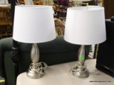 PAIR OF TABLE LAMPS; EACH HAS A WHITE FABRIC BELL SHAPED LAMPSHADE. EACH IS IN EXCELLENT CONDITION