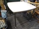 FOLDING CARD TABLE; VINYL TOP AND METAL LEGGED CARD TABLE IN EXCELLENT CONDITION. MEASURES 34 IN X