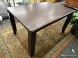 ESPRESSO FINISH TABLE; HAS SQUARE SHAPED LEGS AND IS IN GOOD CONDITION. MEASURES 54 IN X 36 IN X 30