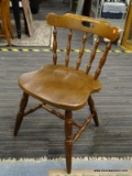 CAPTAINS SIDE CHAIR; MAPLE HANDLED CHAIR WITH SPINDLE BACK AND PLANK BOTTOM SEAT. IS IN EXCELLENT