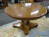 PEDESTAL TABLE; ROUND TOP TABLE WITH A PEDESTAL BASE THAT SITS ON BUN FEET. IS IN EXCELLENT