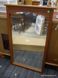 FRAMED MIRROR; OAK FRAMED MIRROR IN EXCELLENT CONDITION. MEASURES 27 IN X 44 IN