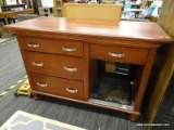 DRESSER; HAS 4 DRAWERS WITH PEWTER HANDLES, A MINI FRIDGE STORAGE AREA THAT MEASURES 18 IN X 21 IN,