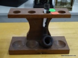 PIPE STAND; HOLDS UP TO 4 PIPES AND INCLUDES A SINGLE WOODEN PIPE (TIP IS DAMAGED)