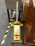 CAR JACK; YELLOW AND WHITE HYDRAULIC JACK. PLEASE PREVIEW FOR EXTRA DETAILS. MEASURES 14 IN X 24 IN