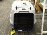 PET CARRIER; GRAY AND BLUE PET CARRIER IN EXCELLENT CONDITION. INCLUDES A PLUSH PET BED INSIDE FOR