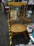 ROCKING CHAIR; MAPLE ROCKING ARM CHAIR WITH ARROW BACK AND PLANK BOTTOM SEAT. IS IN GOOD CONDITION