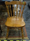 CAPTAINS SIDE CHAIR; CHERRY CHAIR WITH SPINDLE BACK AND PLANK BOTTOM SEAT. IS IN GOOD USED CONDITION